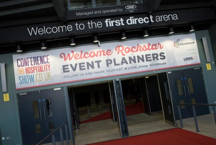 Entrance to first direct arena with white sign welcoming event planners to CHS