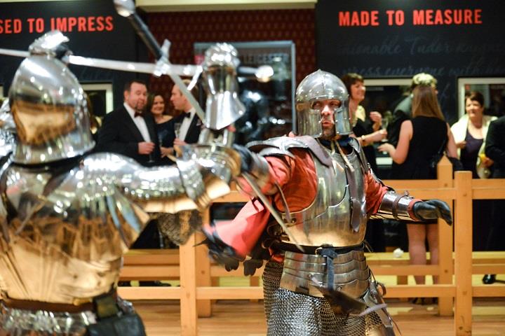 2 men in armour conducting a themed interetation in the Tournamant Gallery at the Royal Armouries, Leeds