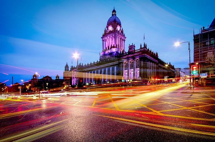 External hyper-lapse image of Leeds Town Hall at night.