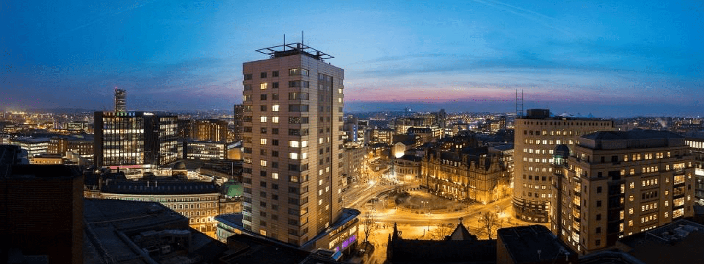 Elevated city scape of Leeds City square at night.