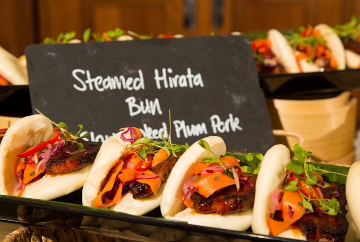 Trays of Steamed Hirata in a bun with a grey slate sign