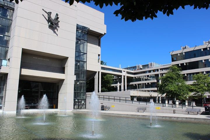External view of Roger Stevens building with water feature at the front.